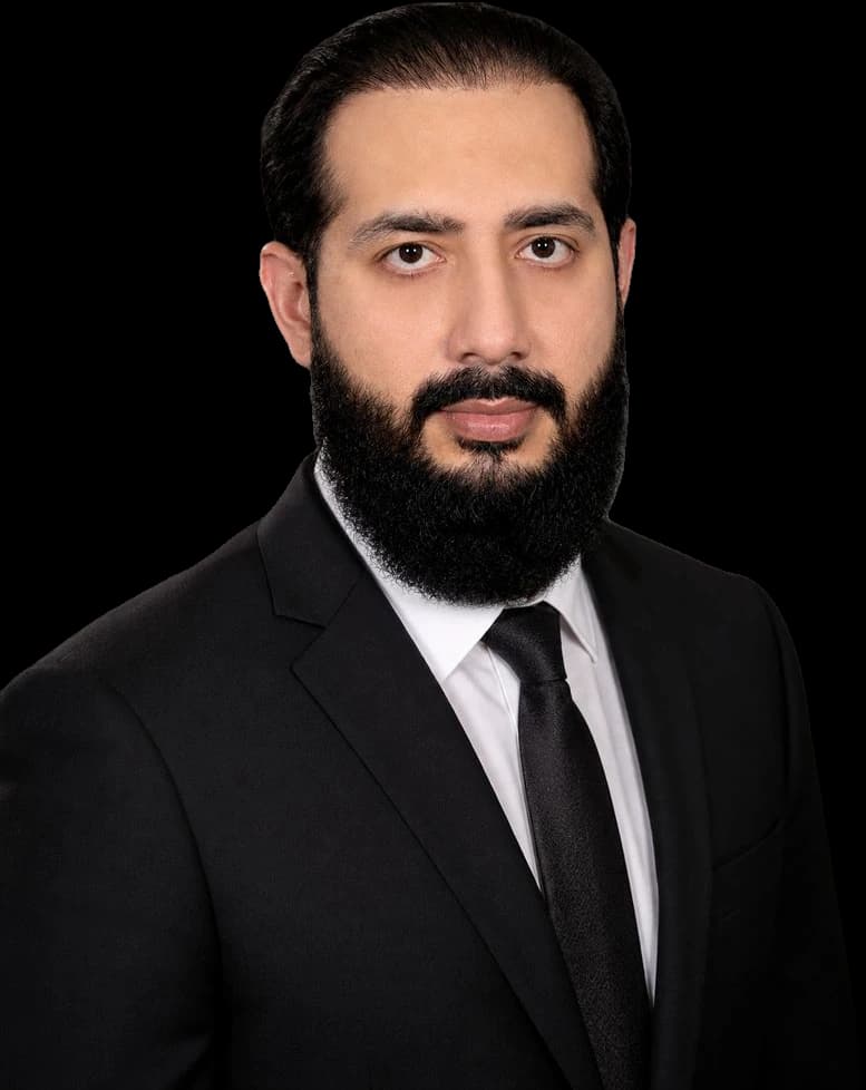 Muhammad Ahsan in formal business attire
