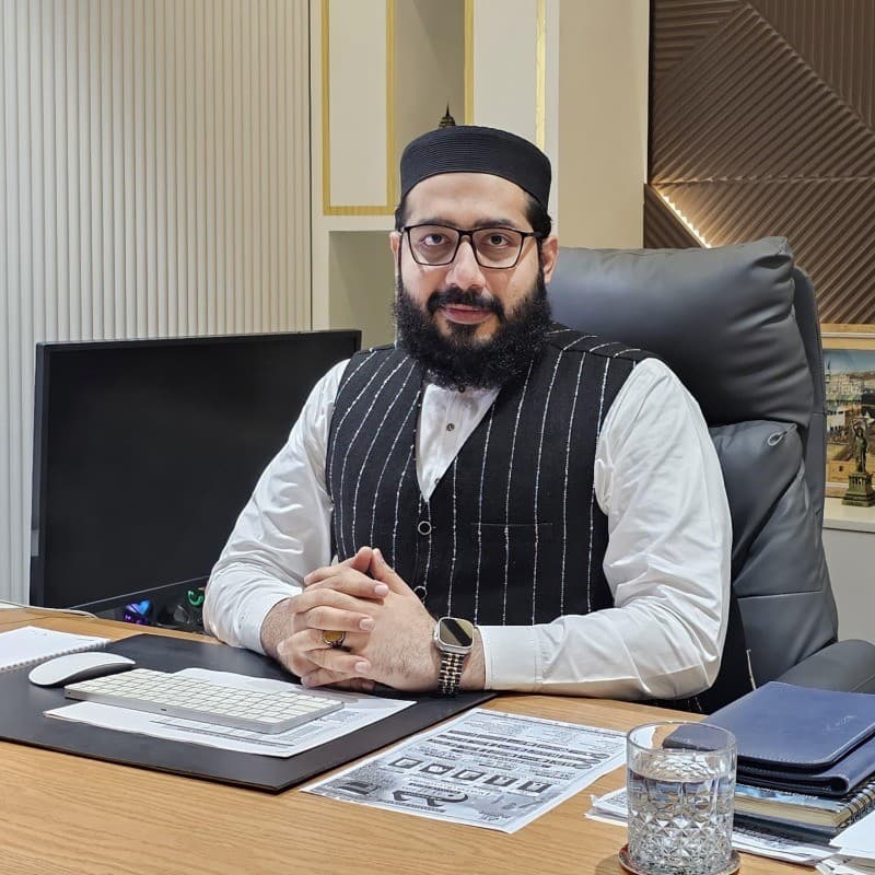 Muhammad Ahsan at his office desk